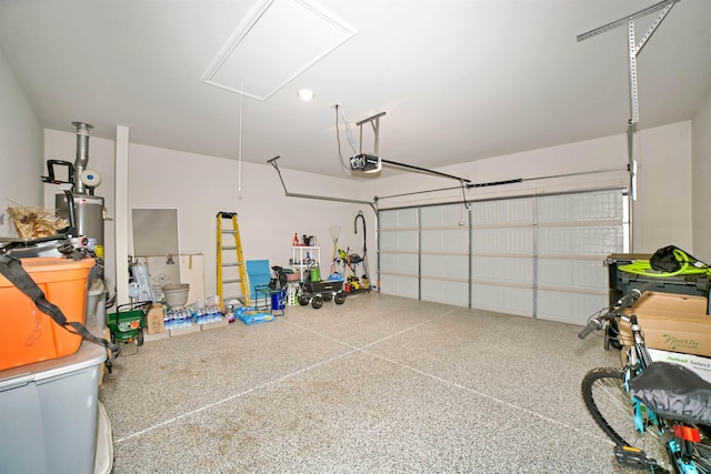  - garage featuring a garage door opener and water heater