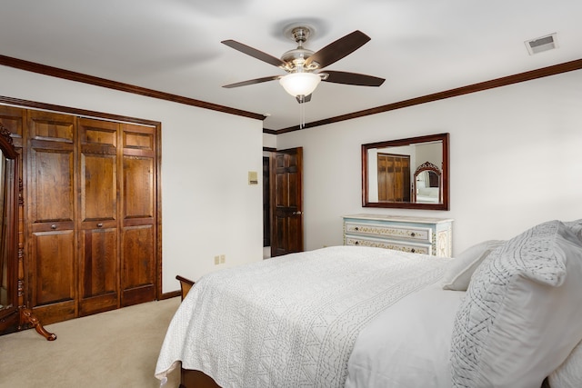 bedroom featuring ceiling fan, carpet, a closet, and ornamental molding