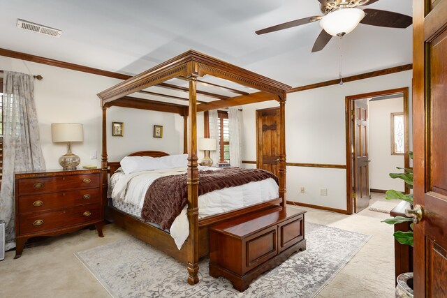 bedroom with ceiling fan, light colored carpet, and ornamental molding