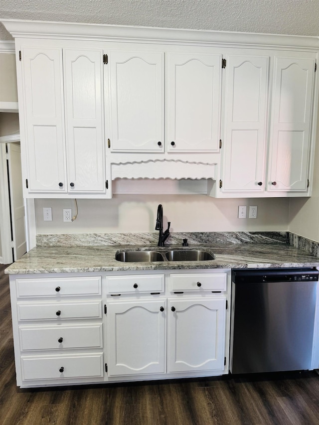 kitchen featuring a sink, light stone counters, stainless steel dishwasher, white cabinetry, and dark wood-style flooring