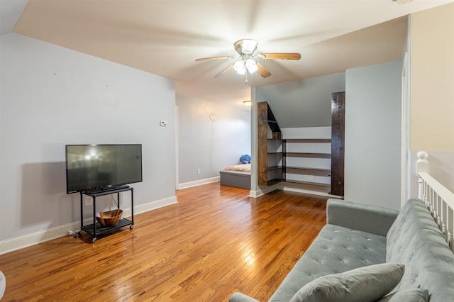  - living area featuring hardwood / wood-style floors and a ceiling fan