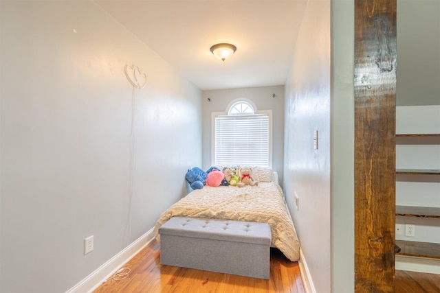  - bedroom with wood finished floors