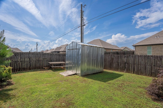  - fenced backyard featuring a shed