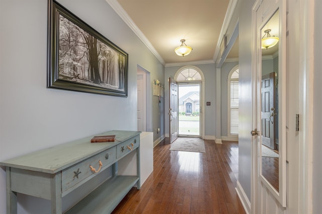  - foyer with dark wood-type flooring and crown molding