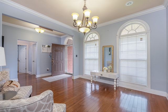  - living room with a chandelier, hardwood / wood-style floors, and crown molding
