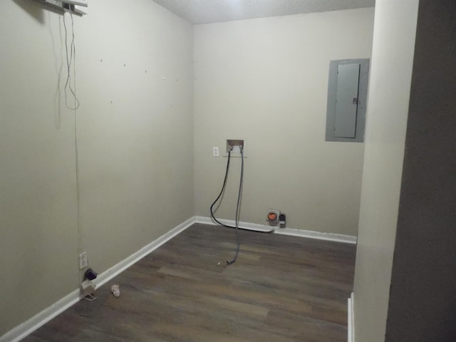  - washroom featuring electric panel, wood finished floors, and washer hookup