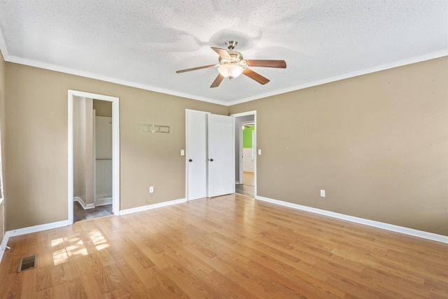  - unfurnished bedroom with light wood-style flooring, crown molding, a textured ceiling, and ceiling fan