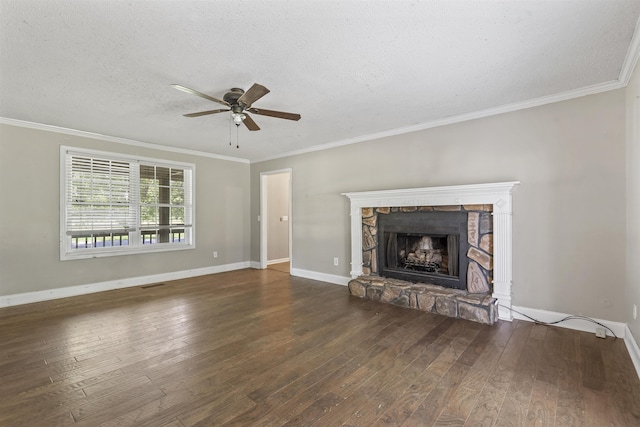  - unfurnished living room featuring wood-type flooring, a fireplace, ceiling fan, crown molding, and a textured ceiling