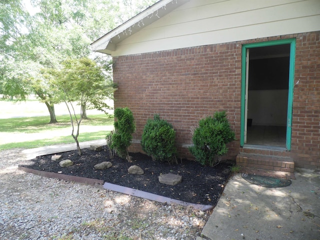  - entrance to property featuring brick siding