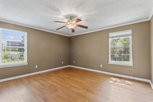  - unfurnished room featuring a ceiling fan, light wood-style flooring, crown molding, and a textured ceiling
