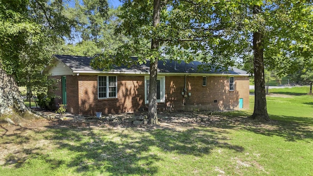  - ranch-style home featuring a front lawn and brick siding