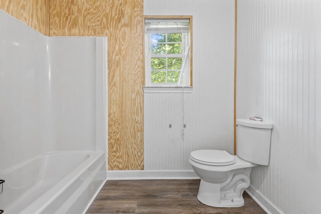  - full bath featuring wood finished floors and tub / shower combination