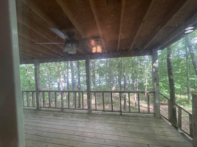 wooden terrace featuring ceiling fan