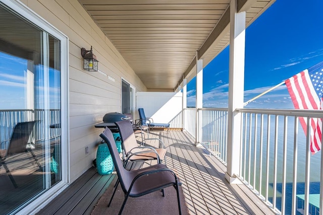 balcony featuring a water view