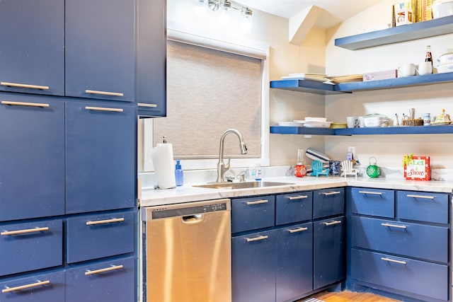 kitchen featuring dishwasher, blue cabinets, light countertops, open shelves, and a sink