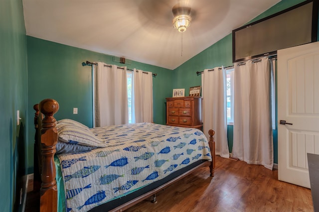 bedroom featuring lofted ceiling, a ceiling fan, and wood finished floors