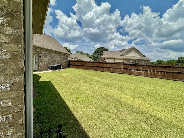 view of yard featuring central AC unit