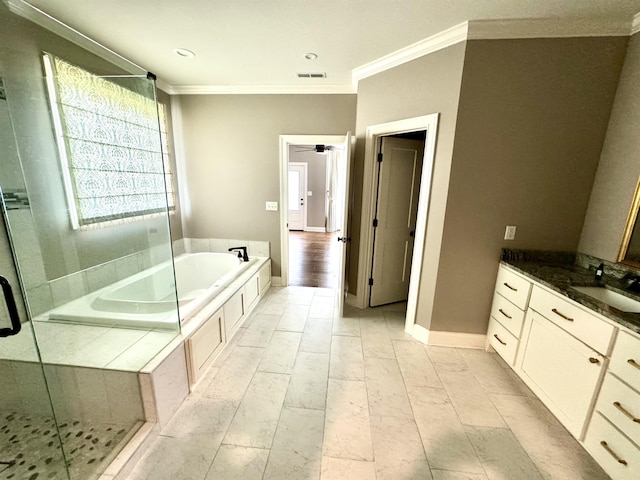 bathroom featuring separate shower and tub, ceiling fan, vanity, and ornamental molding