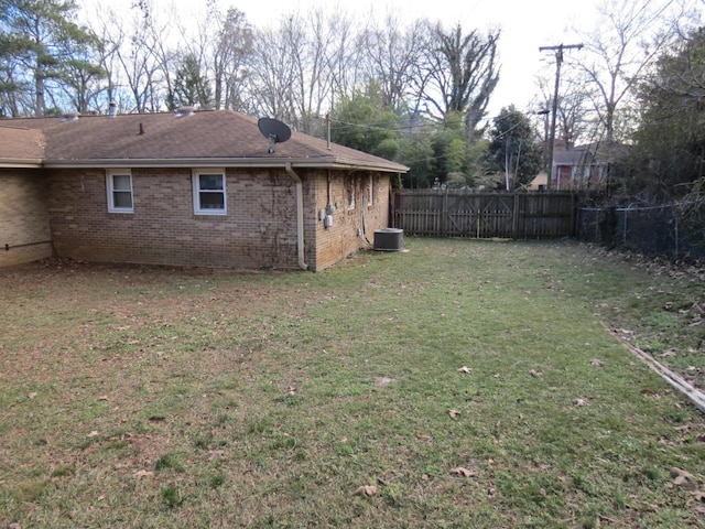 view of yard with central air condition unit