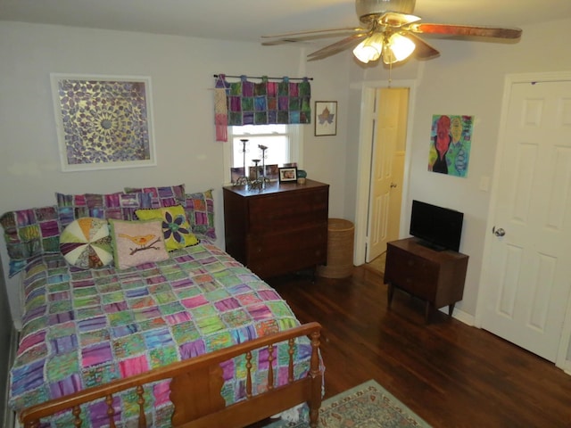 bedroom featuring dark hardwood / wood-style floors and ceiling fan