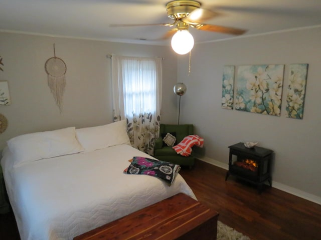 bedroom featuring ceiling fan and dark hardwood / wood-style flooring