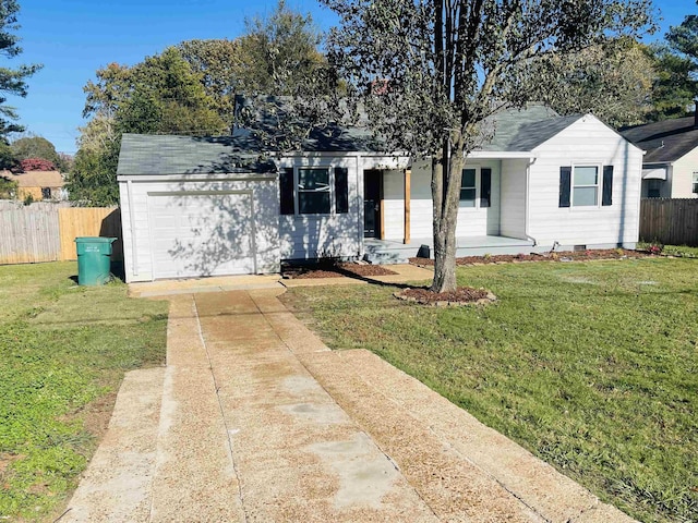 single story home with a garage and a front yard