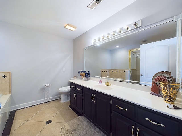 bathroom featuring tile patterned floors, vanity, and toilet