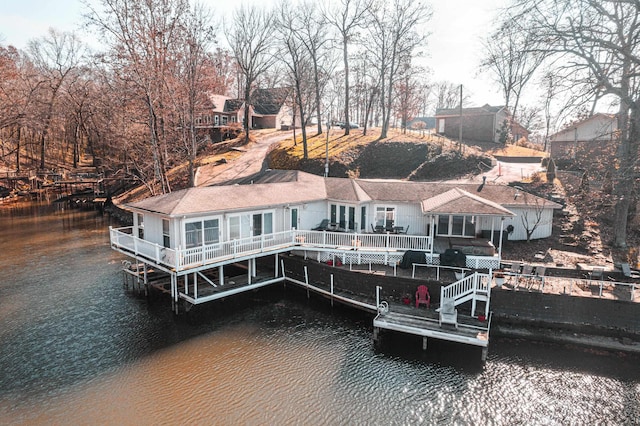 dock area with a deck with water view