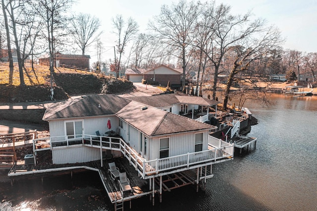 view of dock with central AC and a deck with water view