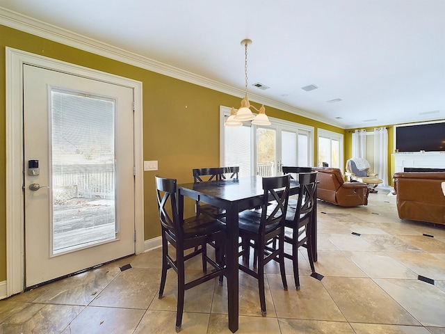 tiled dining space with crown molding