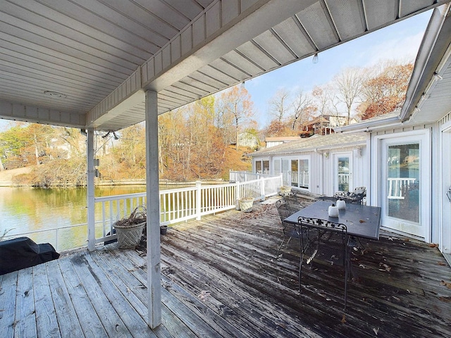 wooden deck with a water view