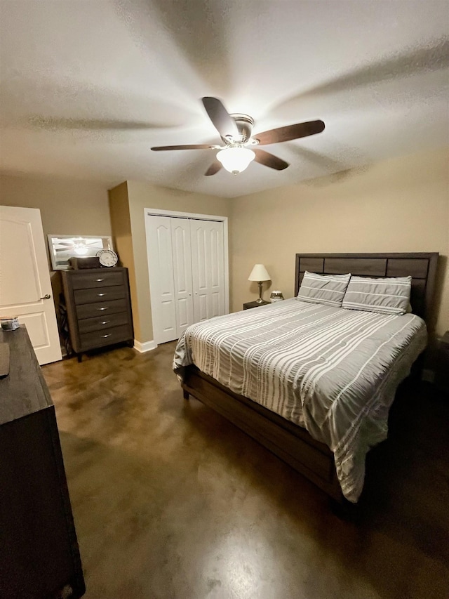 bedroom with ceiling fan and a closet