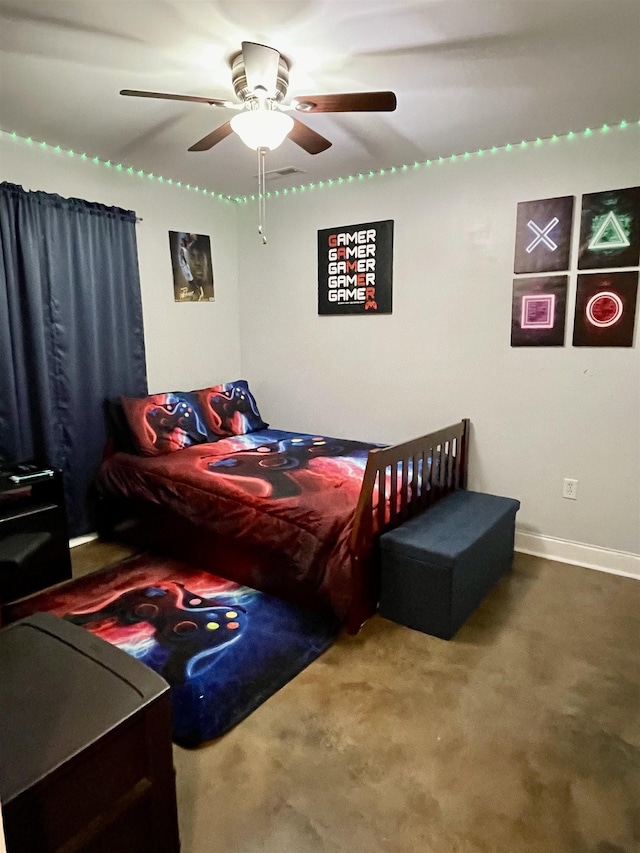 carpeted bedroom with ceiling fan and baseboards