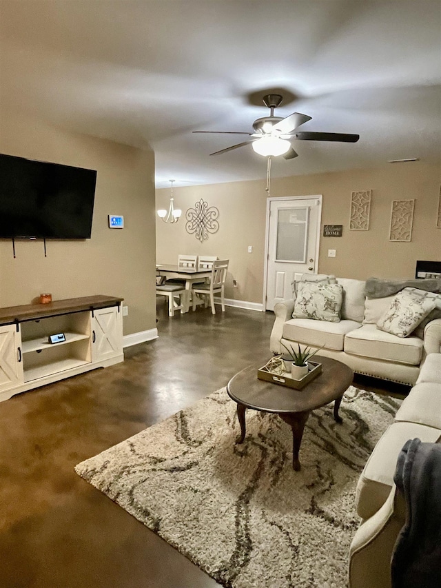 living room with ceiling fan and baseboards