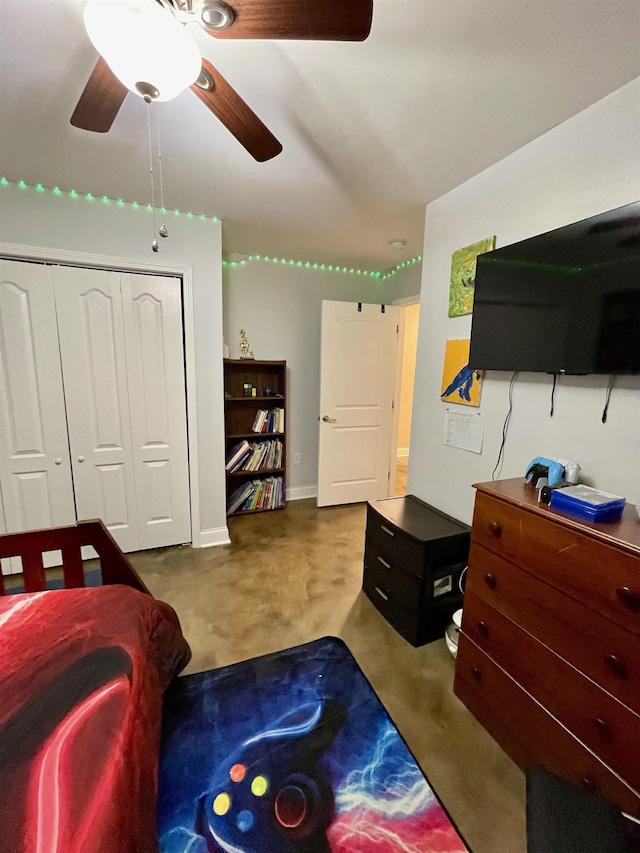 bedroom featuring finished concrete floors, a closet, and ceiling fan