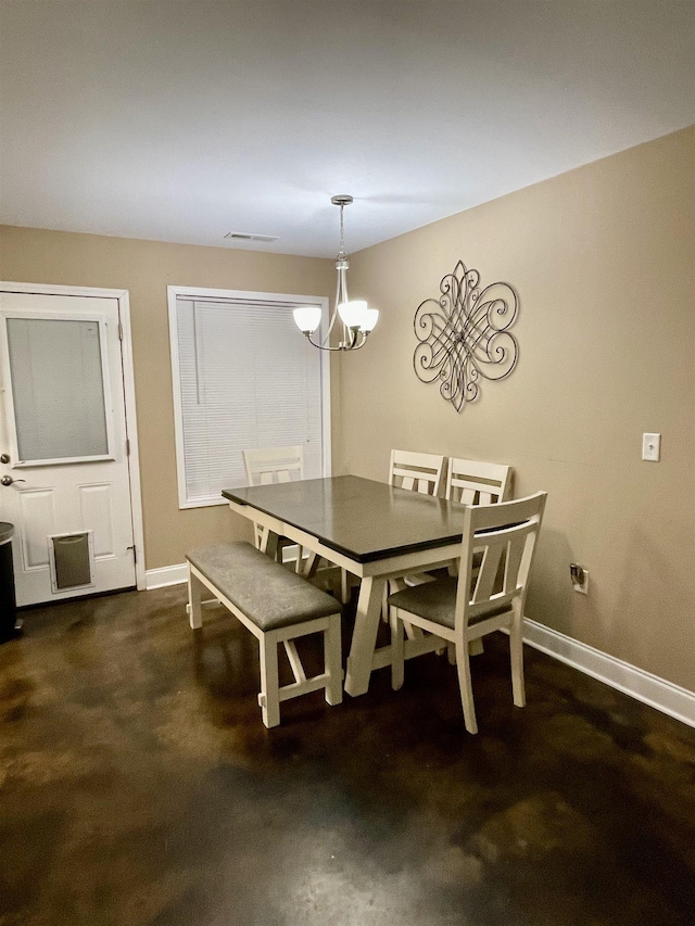 dining area featuring a chandelier, visible vents, and baseboards