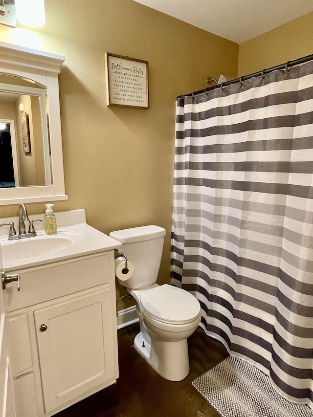 full bathroom with toilet and vanity