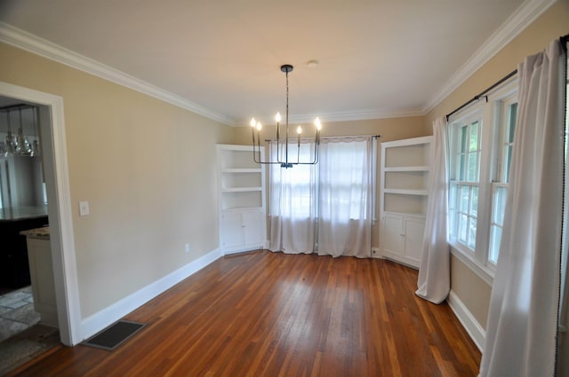  - unfurnished dining area featuring a chandelier, dark wood-style flooring, baseboards, and crown molding
