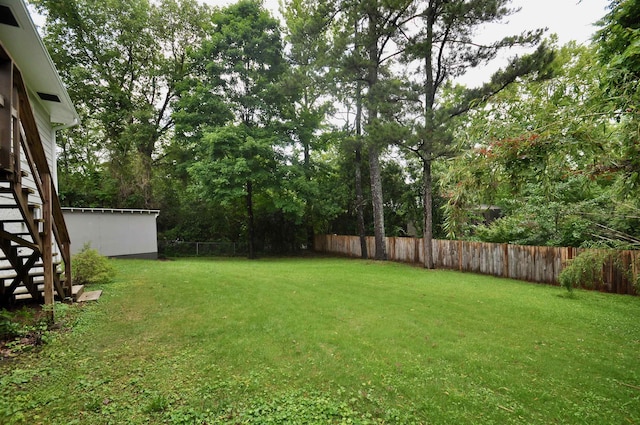  - view of yard featuring stairs