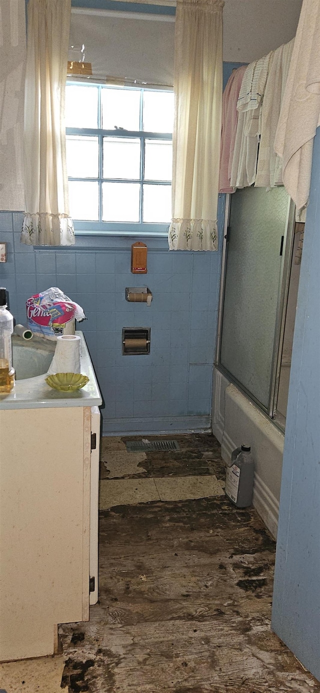  - full bathroom with vanity, tile walls, and wood finished floors