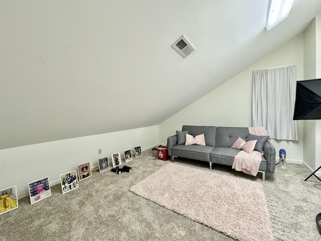 carpeted living room with lofted ceiling