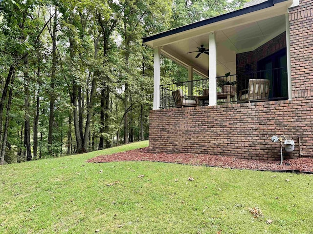 view of yard featuring ceiling fan