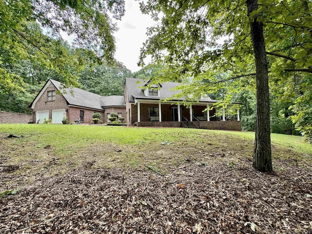 exterior space with a front yard and a porch