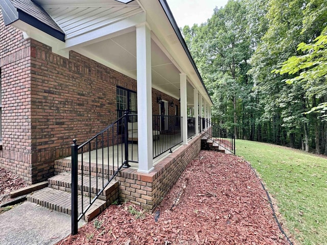 view of property exterior featuring a lawn and a porch