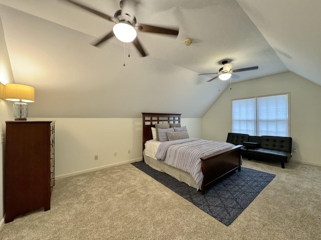 carpeted bedroom featuring ceiling fan and lofted ceiling