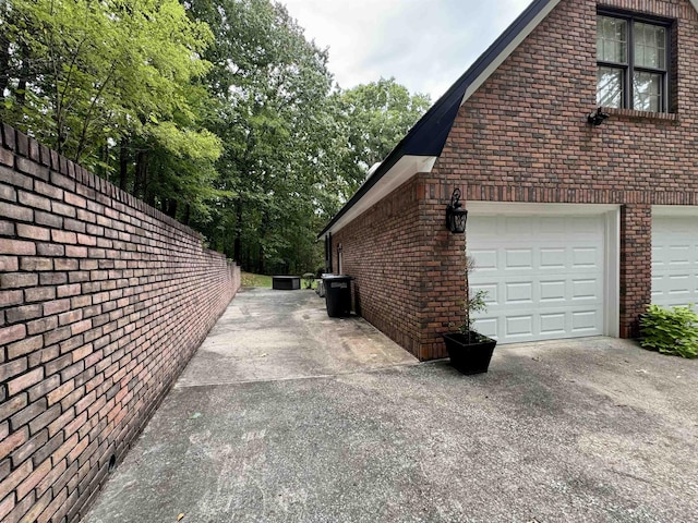 view of side of property with a garage