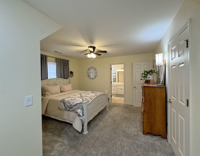 bedroom featuring ceiling fan, carpet floors, and ensuite bathroom