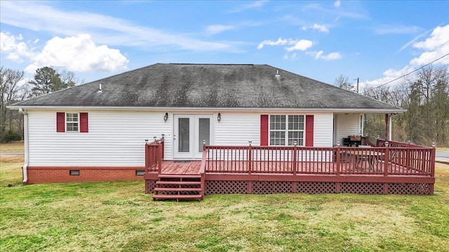 back of house with a wooden deck and a yard