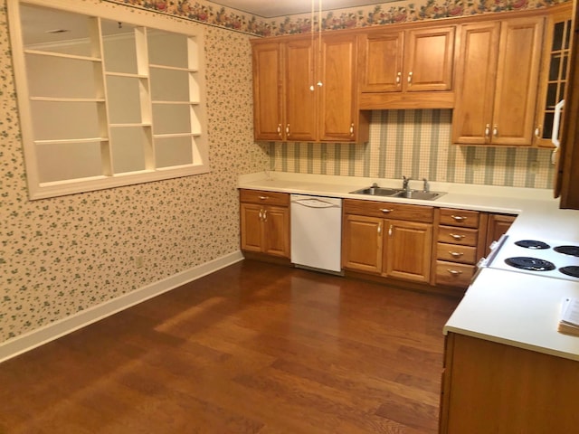 kitchen with cooktop, sink, white dishwasher, and dark wood-type flooring