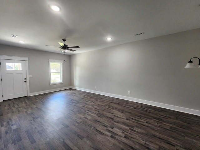 interior space with ceiling fan and dark hardwood / wood-style flooring